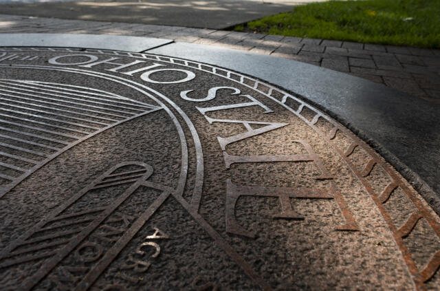Picture of the Ohio State University's seal on the ground at The Oval